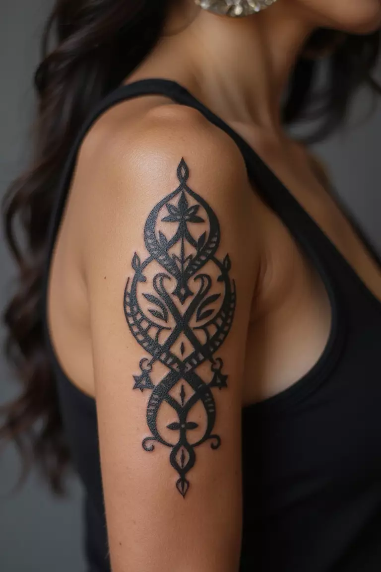 African Adinkra Symbols A close-up shot of a woman showing her black ink African Adinkra Symbols Gye Nyame tattoo design on her arm