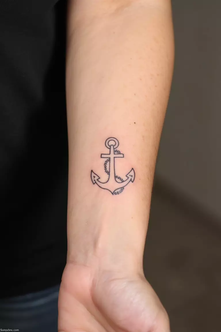 Anchor Outline with Dots A close up shot of woman's arm with a black ink anchor outline with dots tattoo.